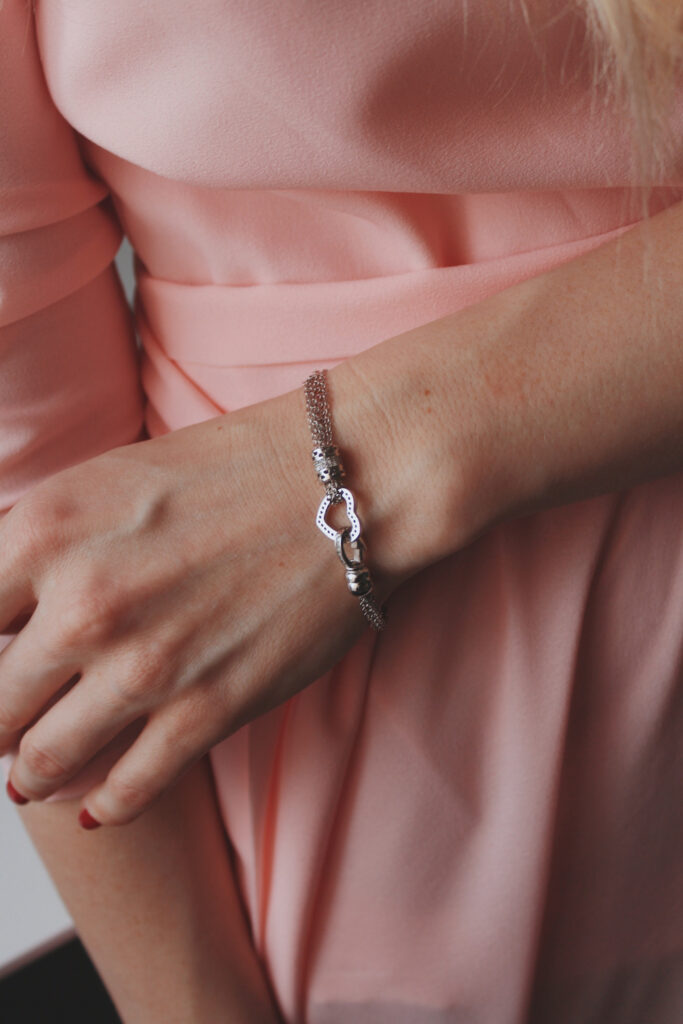Female jewelry model wearing white gold bracelet